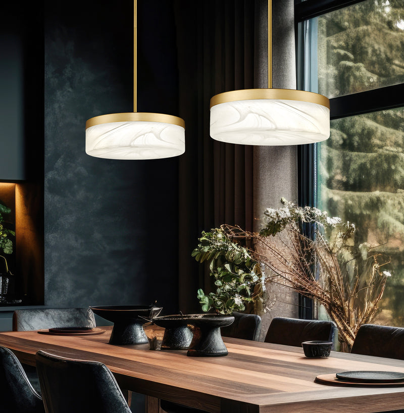 Renaud 1 Light 13" Pendant in Modern Gold in a room setting