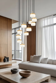 Renaud 11 Light 28" Pendant in Modern Gold in a room setting