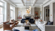 Renaud 11 Light 28" Pendant in Modern Gold in a room setting