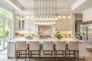 Renaud 23 Light 58.75" Linear Pendant in Modern Gold in a room setting