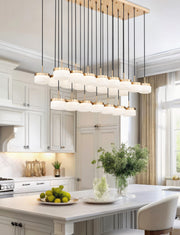 Renaud 23 Light 58.75" Linear Pendant in Modern Gold in a room setting