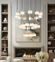 Renaud 27 Light 40.75" Pendant in Modern Gold in a room setting