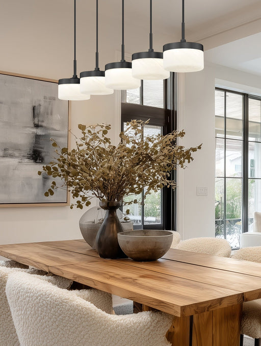 Renaud 5 Light 46" Linear Pendant in Matte Black in a room setting