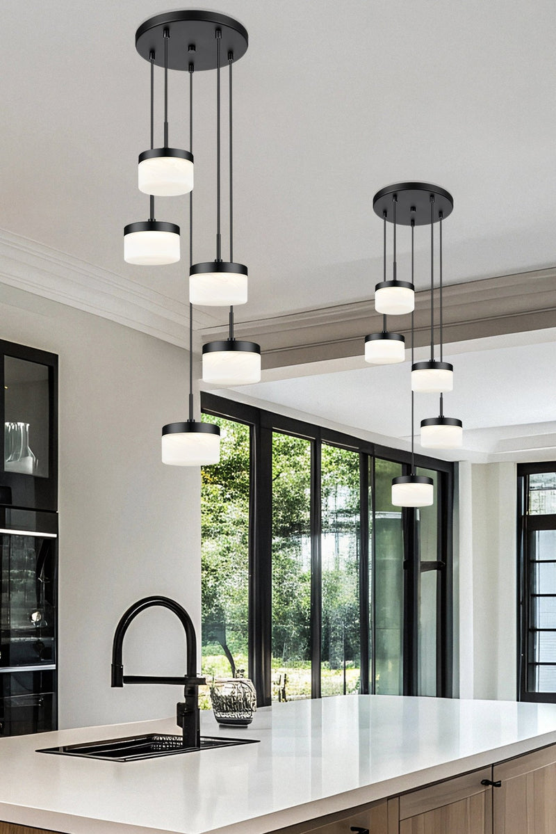 Renaud 5 Light 15.75" Pendant in Matte Black in a room setting