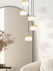 Renaud 5 Light 15.75" Pendant in Modern Gold in a room setting