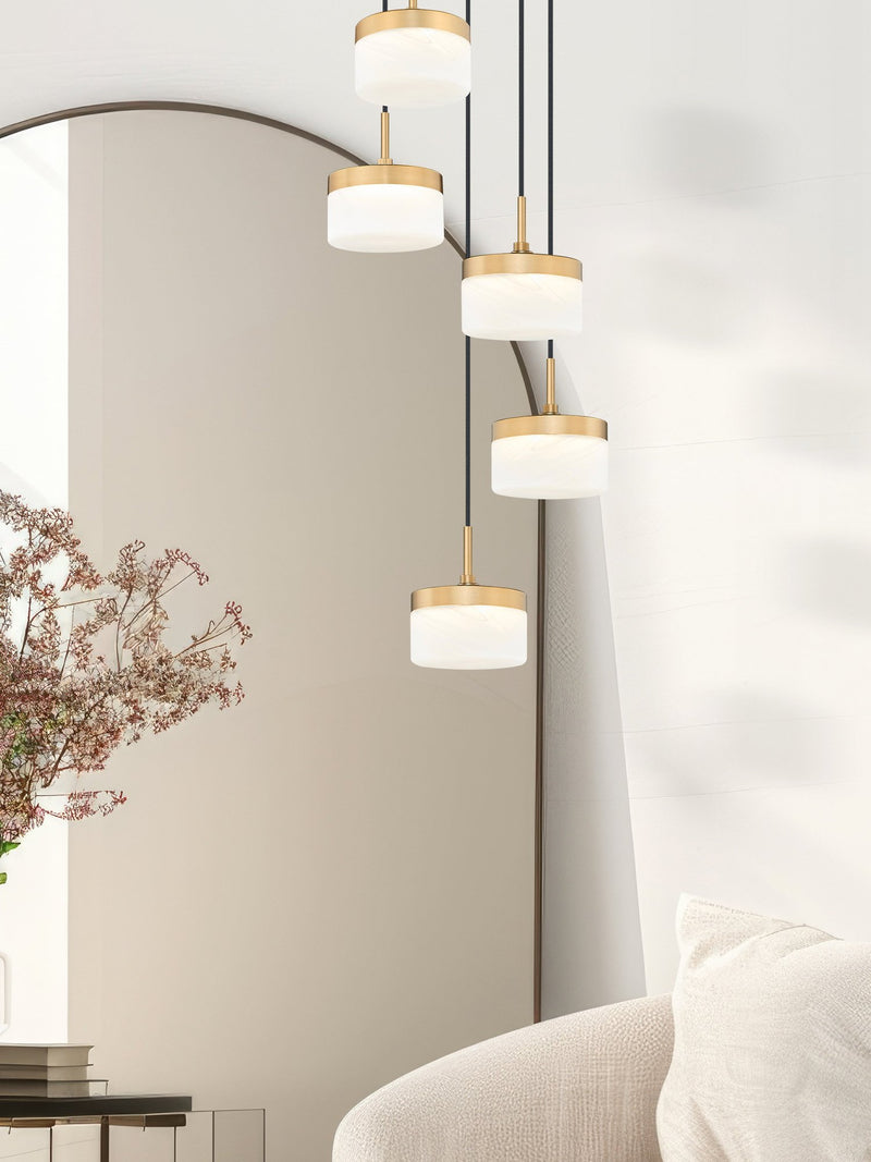Renaud 5 Light 15.75" Pendant in Modern Gold in a room setting