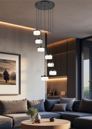Renaud 7 Light 21" Pendant in Matte Black in a room setting