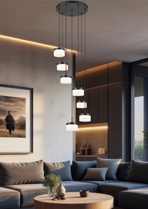 Renaud 7 Light 21" Pendant in Matte Black in a room setting