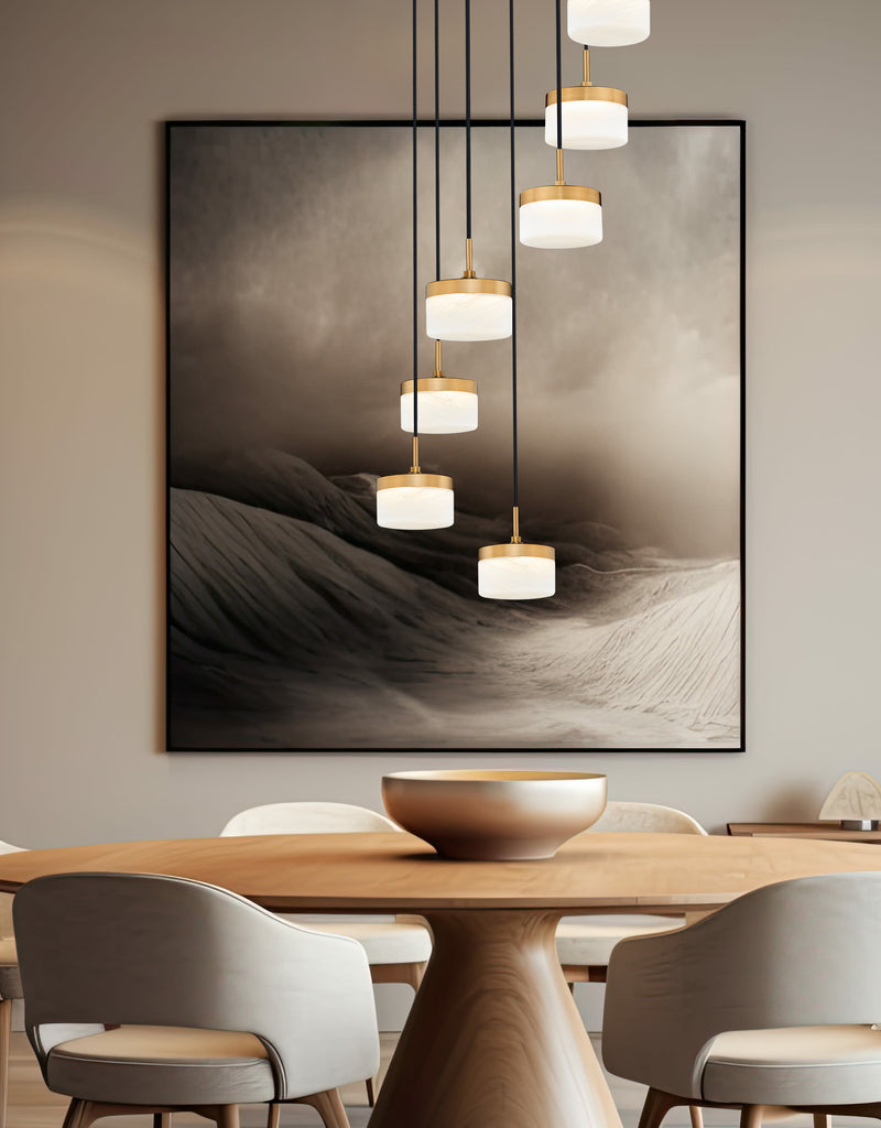 Renaud 7 Light 21" Pendant in Modern Gold in a room setting