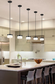 Renaud 1 Light 6.75" Pendant in Matte Black in a room setting