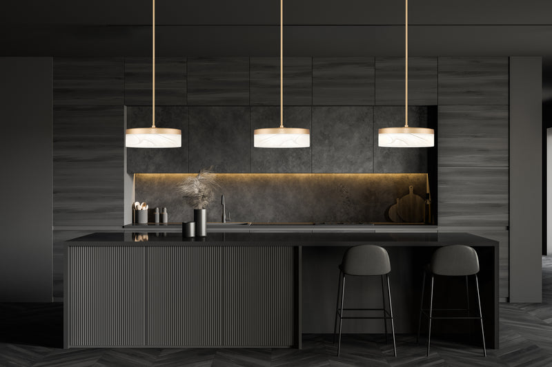 Renaud 1 Light 9.25" Pendant in Modern Gold in a room setting