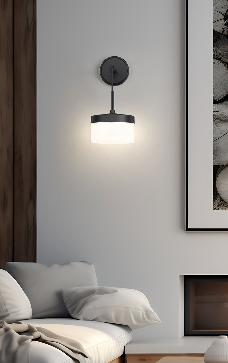Renaud 1 Light 6.75" Wall Sconce in Matte Black in a room setting