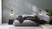 Renaud 1 Light 6.75" Wall Sconce in Matte Black in a room setting