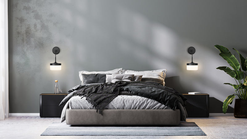 Renaud 1 Light 6.75" Wall Sconce in Matte Black in a room setting