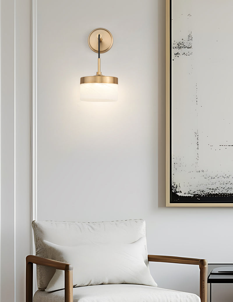 Renaud 1 Light 6.75" Wall Sconce in Modern Gold in a room setting