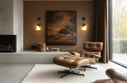 Aimie 1 Light 6" Wall Sconce in Matte Black in a room setting