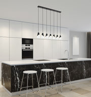Aimie 7 Light 54" Linear Pendant, 13.25" Tall in Brushed Nickel in a room setting