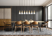 Aimie 7 Light 54" Linear Pendant, 13.25" Tall in Modern Gold in a room setting