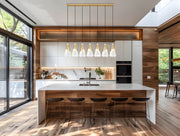 Aimie 7 Light 54" Linear Pendant, 15.75" Tall in Modern Gold in a room setting
