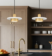 Ludo 1 Light 12" Pendant in Matte White + Modern Gold in a room setting