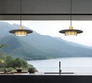 Ludo 1 Light 16" Pendant in Matte Black + Modern Gold in a room setting