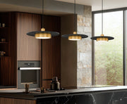 Ludo 1 Light 20" Pendant in Matte Black + Modern Gold in a room setting