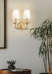 Aslin 2 Light 11.75" Wall Sconce in Gold Leaf in a room setting