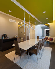 Forest 12 Light 43.75" Linear Pendant in Chrome in a room setting