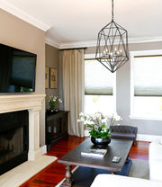 Geo 6 Light 21.5" Chandelier in Matte Black + Chrome in a room setting