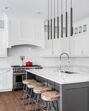 Forest 7 Light 54" Linear Pendant, 23.75" Tall in Matte Black in a room setting