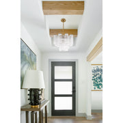 Addis 4 Light 17.75" Pendant in Aged Brass in a room setting