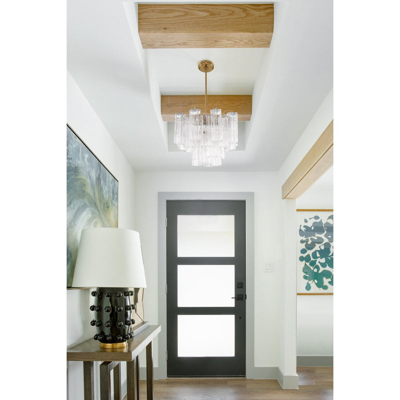 Addis 4 Light 17.75" Pendant in Aged Brass in a room setting
