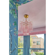 Addis 4 Light 17.75" Pendant in Aged Brass in a room setting