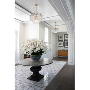 Addis 6 Light 19.75" Chandelier in Aged Brass in a room setting