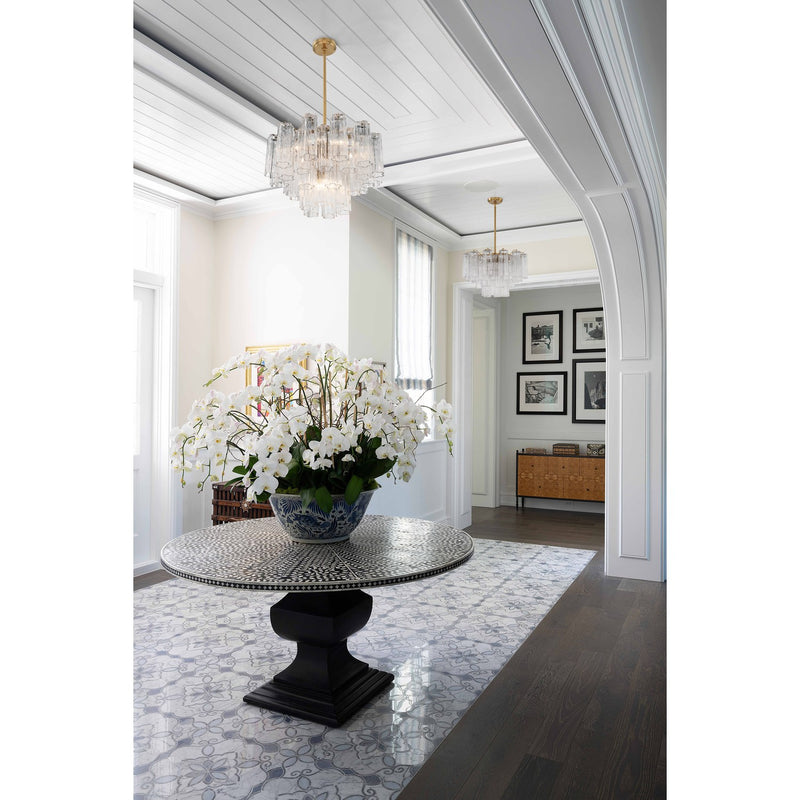 Addis 6 Light 19.75" Chandelier in Aged Brass in a room setting