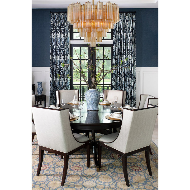 Addis 12 Light 26.75" Pendant in Aged Brass in a room setting