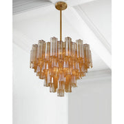 Addis 12 Light 26.75" Pendant in Aged Brass in a room setting