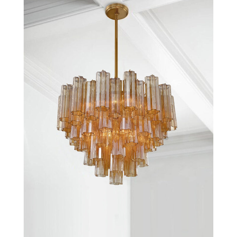 Addis 12 Light 26.75" Pendant in Aged Brass in a room setting