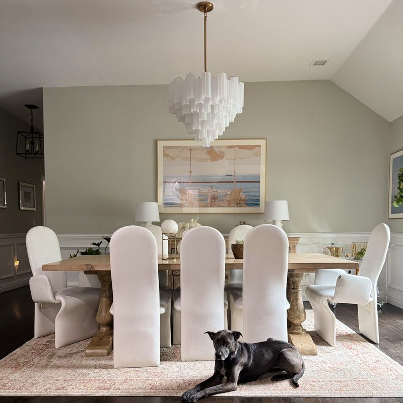 Addis 12 Light 26.75" Pendant in Aged Brass in a room setting