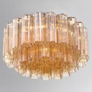 Addis 6 Light 22.25" Flush Mount in Aged Brass in a room setting