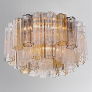 Addis 6 Light 22.25" Flush Mount in Aged Brass in a room setting