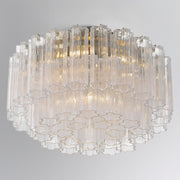 Addis 6 Light 22.25" Flush Mount in Aged Brass in a room setting