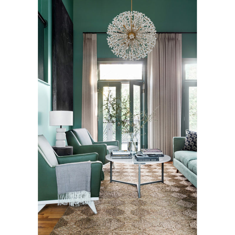 Adley 12 Light 34" Chandelier in Aged Brass in a room setting