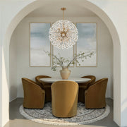 Adley 12 Light 34" Chandelier in Aged Brass in a room setting