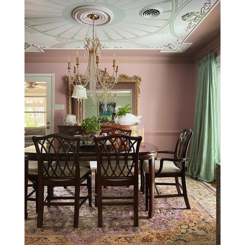 Arcadia 8 Light 26.75" Chandelier in Antique Gold in a room setting