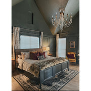 Arcadia 8 Light 26.75" Chandelier in Antique Gold in a room setting