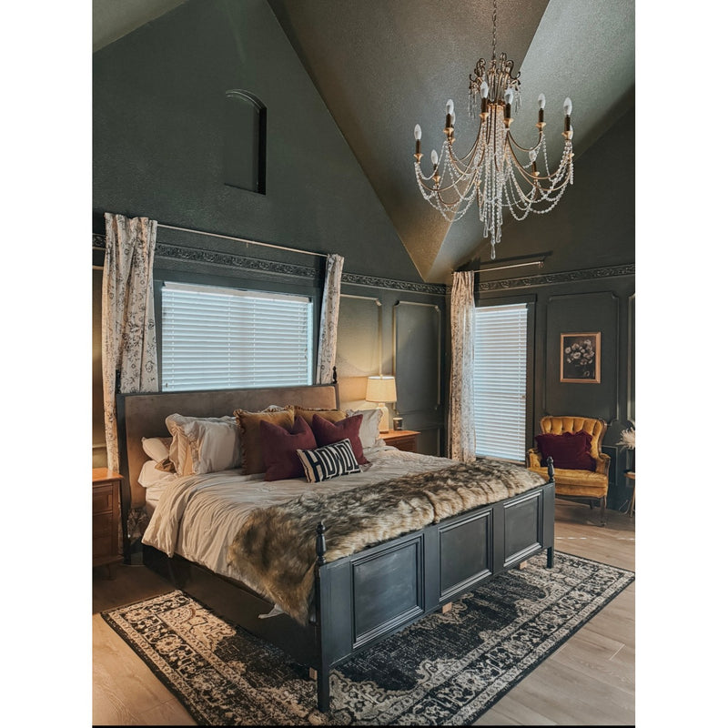 Arcadia 8 Light 26.75" Chandelier in Antique Gold in a room setting