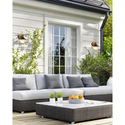 Atlas 1 Light 9.75" Outdoor Sconce in Matte Black + Textured Gold in a room setting