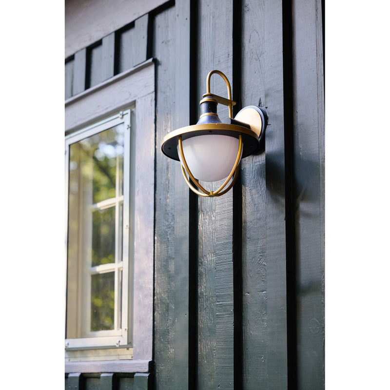 Atlas 1 Light 9.75" Outdoor Sconce in Matte Black + Textured Gold in a room setting