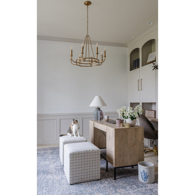 Bailey 8 Light 28" Chandelier in Aged Brass in a room setting